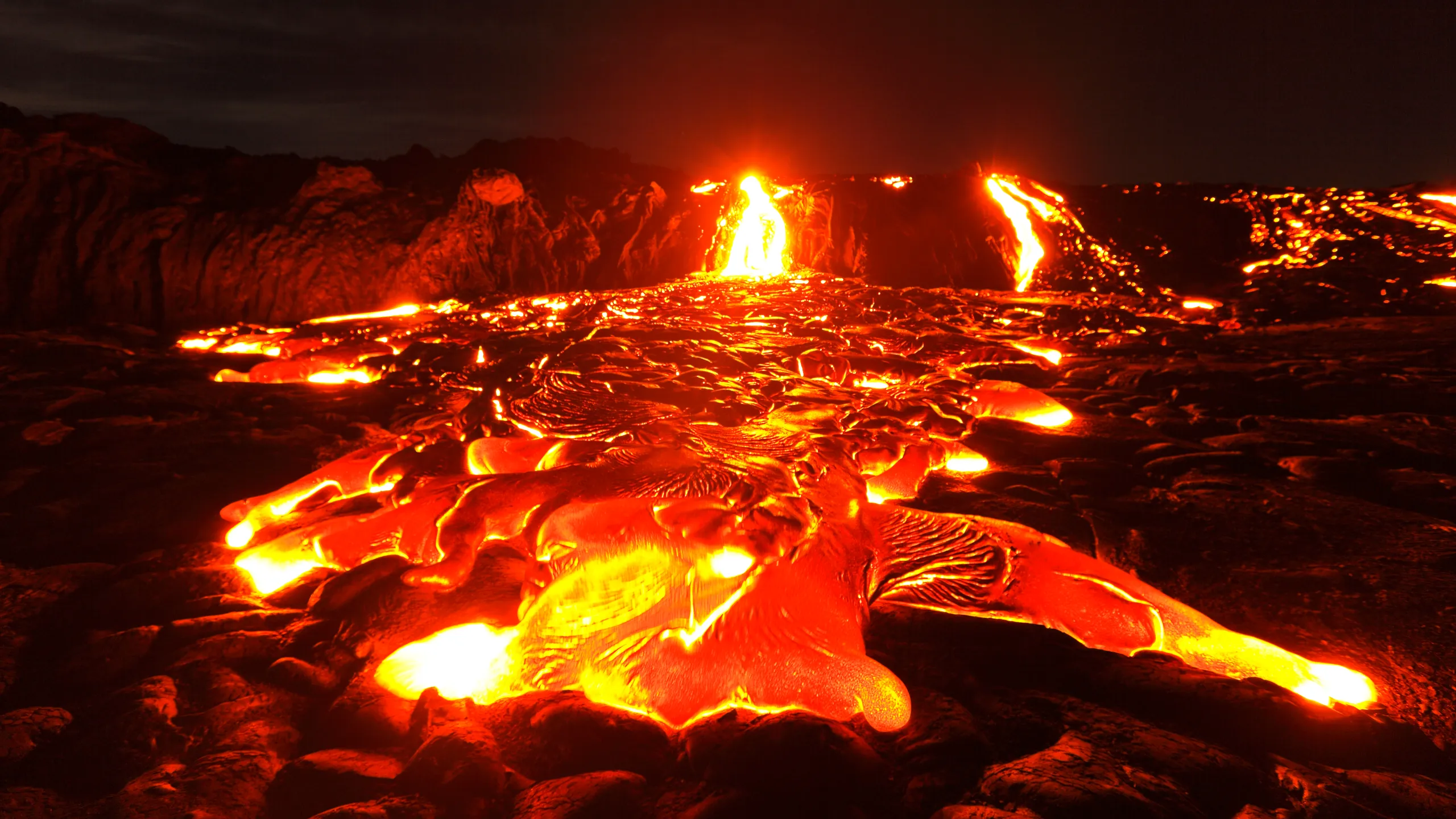 A stunning view of the Hawaiian islands with volcanic mountains and lush greenery.