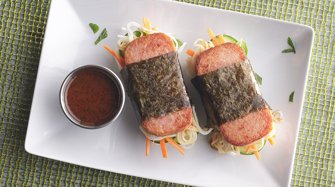 A delicious plate of Spam musubi with rice and seaweed, showcasing Hawaiian culinary tradition.