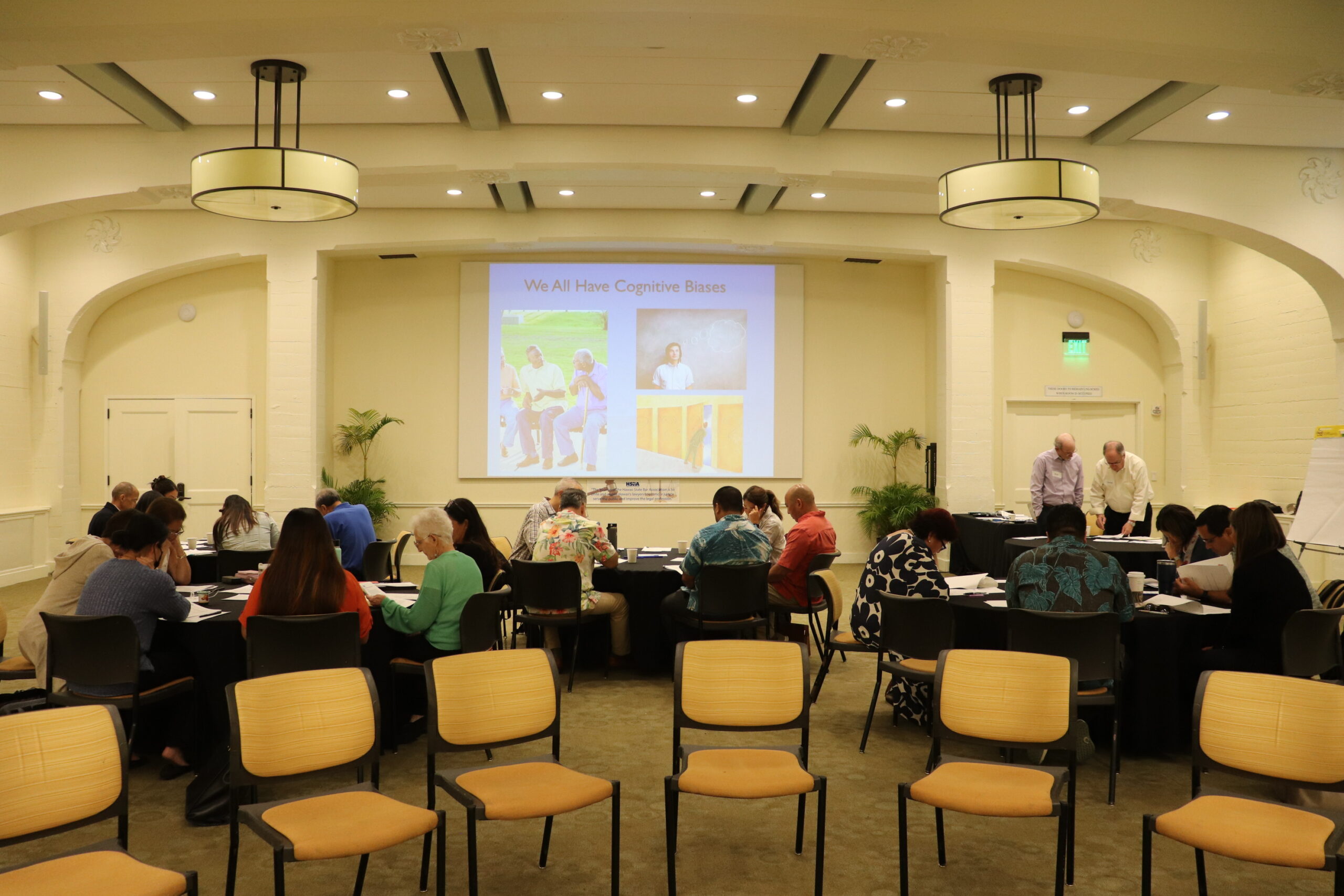 A group of diverse attorneys at a conference representing the Hawaii State Bar Association, showcasing professionalism and community.